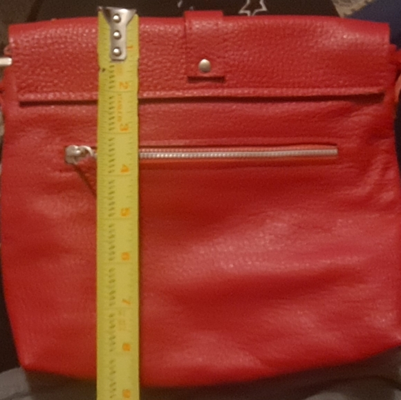New buttery leather red crossbody. Snap Closure. Clean Inside. 1 Pocket In/out. - Picture 5 of 8